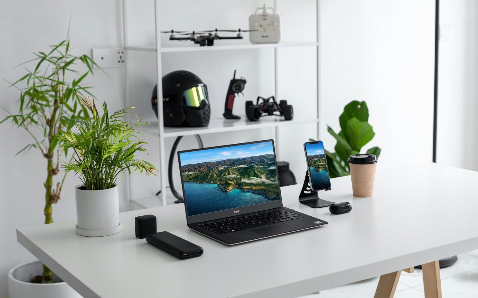 black laptop computer on white table